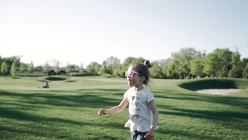 Young bautiful mother withe her cute little daughter are playing. Smiling closeup.