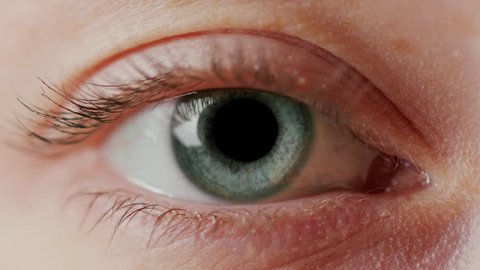 close-up beautiful blue eye opening human iris macro natural beauty