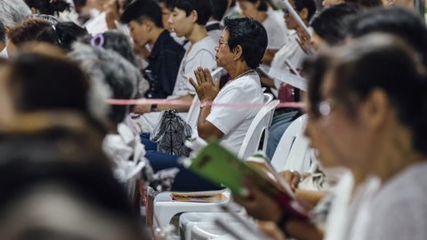 Bangkok / Thailand - December 31 2018: Thai Buddhists pray at a New Year ceremony.