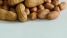 crusty raw groundnut, hd video, on white background