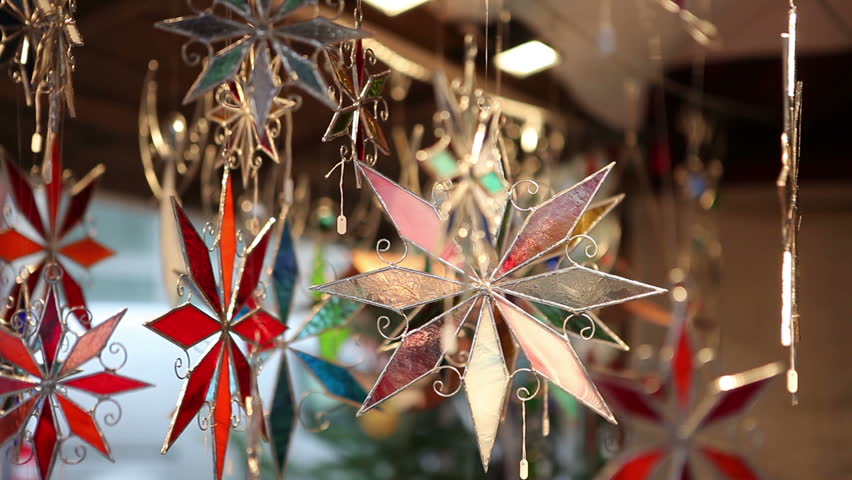 Souvenir shop on the market. Multicolored asterisks glass souvenirs. Christmas market.