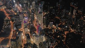 Fly up over Urban city scene around central area victoria habour in night light, Hong Kong , 4k high resolution video