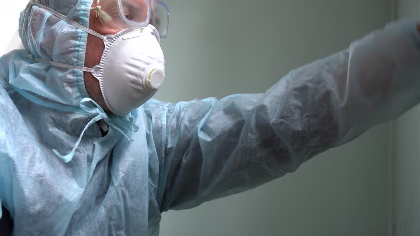 Coronavirus pandemic (COVID-19) mers - Cleaning and Disinfection. Professional teams for disinfection efforts. Infection prevention and control of epidemic. Protective suit and mask Royalty-Free Stock Footage #1021706938