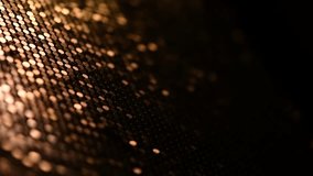Abstract particle background, data techno backdrop with golden glowing dots, hi-tech concept, gold color screen. Glowing dots on black background. 4K UHD video, Slow motion