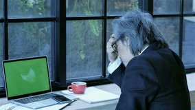 Senior businessman are strained to investment Business crisis, corona virus covid-19 pandemic impact working with laptop computer green screen and smartphone  - Powered by Shutterstock - Get 15% off with code: PIKWIZARD15