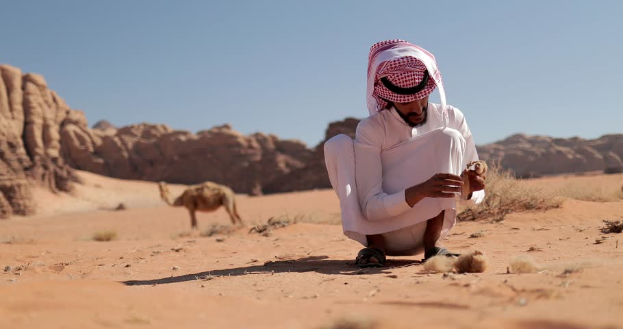 Bedouin man with his camels Jordan Wadi Rum Desert