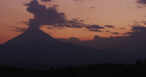 Sunset time of smoke flowing out of Popocatepetl Volcano in Puebla, Mexico.