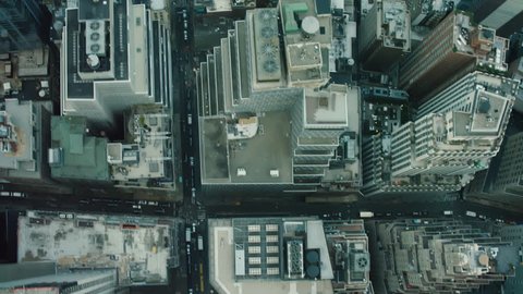 Top down aerial view of New York City streets and buildings with soft natural light. Shot on 4k RED camera on helicopter.