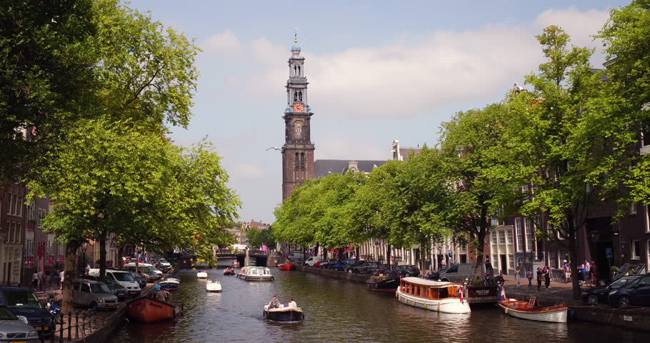 Amsterdam, Noord-Holland / Netherlands August 22 2018 - The Prinsengracht with the Westertoren / Westerkerk