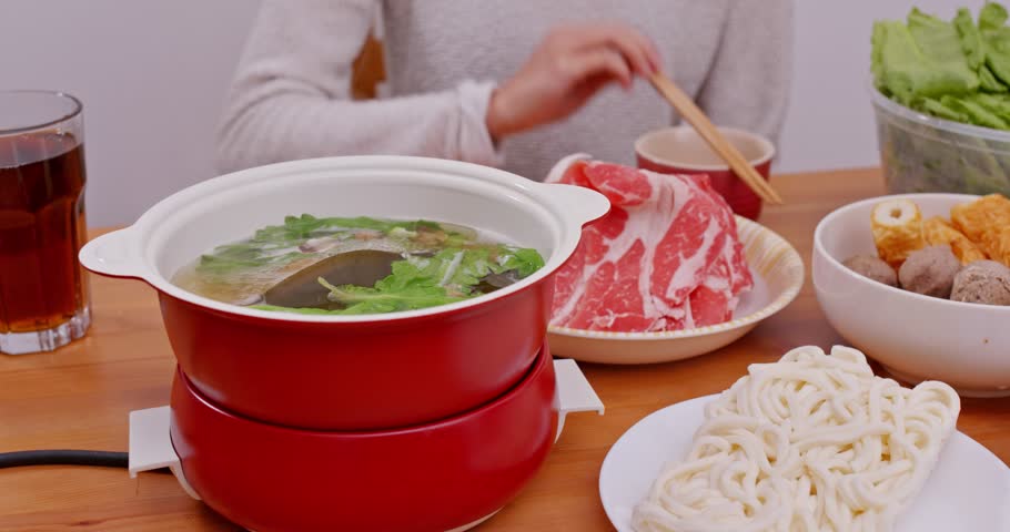 Family having hot pot at home