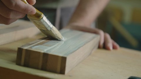 Applying glue on wood