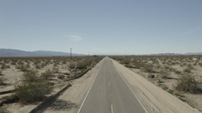 Clip of drone aerial flying over Route 66 in the desert near Amboy, California.