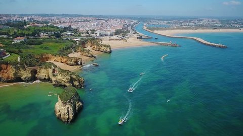Aerial. Beautiful Portuguese beaches and shores of the city of Lagos. View from the sky, Algarve.