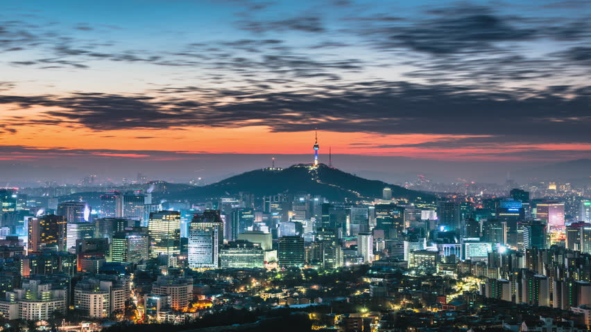 Time lapse day to night skyline of Seoul, South Korea. Zoom in