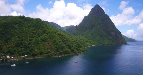 Drone view of the Pitons in the Caribbean Island of St. Lucia with birds flying