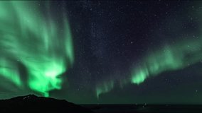 A time lapse of the northern lights and milky way over the sea and islands of Northern Norway. Captured near Rekvik on the island Kvaløya, just outside Tromsø. - Powered by Shutterstock - Get 15% off with code: PIKWIZARD15