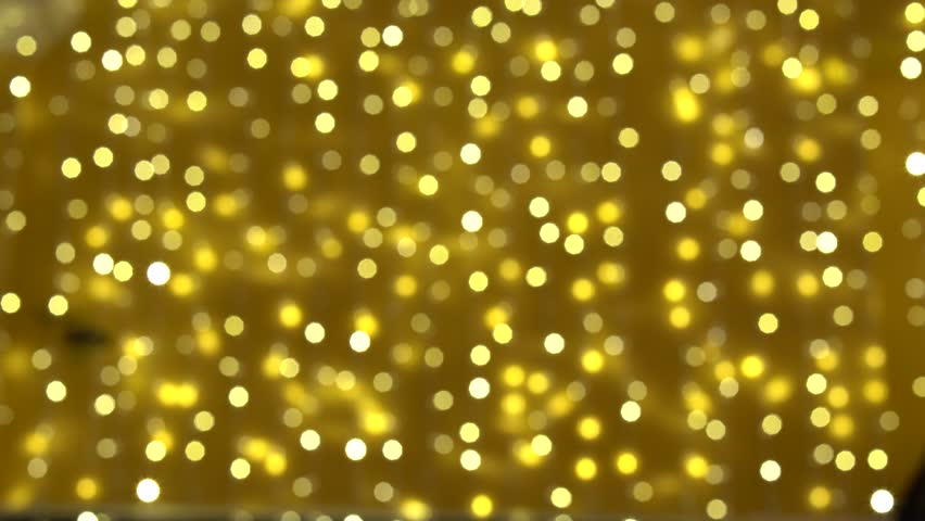 Deliberately blurred image of people walking around the festive city. Christmas lights. Christmas mood in the city.