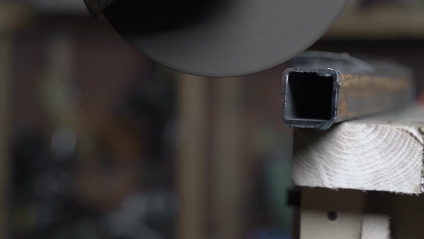 Cutting disc grinder cuts metal. Close up.