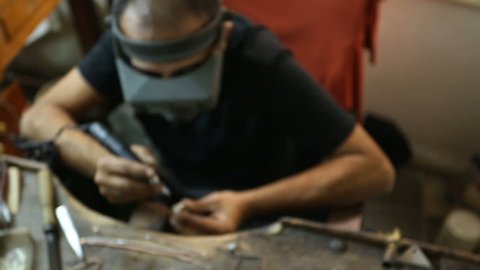 jeweler master working in workshop. hand made jewelery. turkish jewelery craftsman