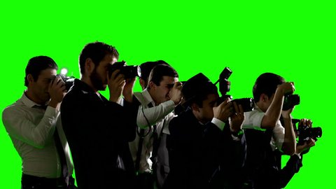 Group of paparazzi or journalists. Photo shoot on green screen. Slow motion. Shot on RED EPIC Cinema Camera.