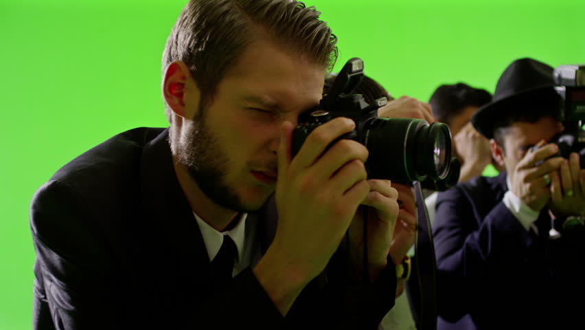 Group of paparazzi or journalists on green screen . Group of photographers photo shooting on green screen. Slow motion. Shot on RED EPIC Cinema Camera.