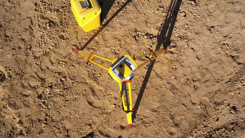 aerial view of a surveyors instrument, a robotic total station theodolite Royalty-Free Stock Footage #1021880944