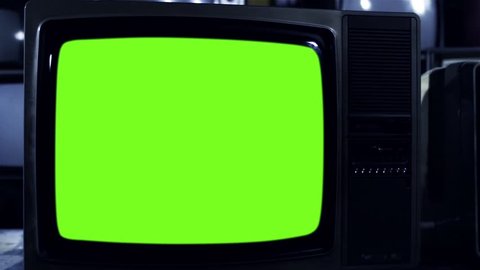 Vintage Television Set Turning On Green Screen with Noise. Night Tone. You can replace green screen with the footage or picture you want. You can do it with “Keying” effect in After Effects.