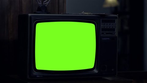 Old Television Set Turning On Green Screen with Static Noise. Night Tone. You can replace green screen with the footage or picture you want. You can do it with “Keying” (Chroma Key) effect.