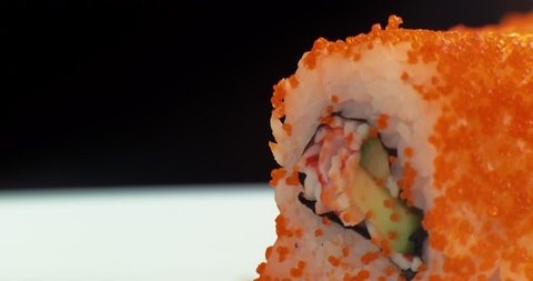 Slide motion of sushi food served on white plate. Macro. 4K.