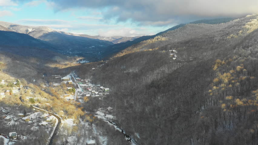 Road near forest Sabaduri. Fog. Cloud over forest. Winter. Winter sky. Clouds. Small village in the gorge. Mountain valley