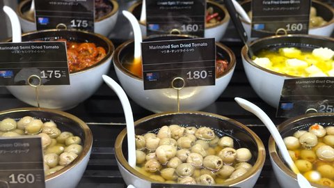 Assortment Of Marinated Olives On Display At Supermarket