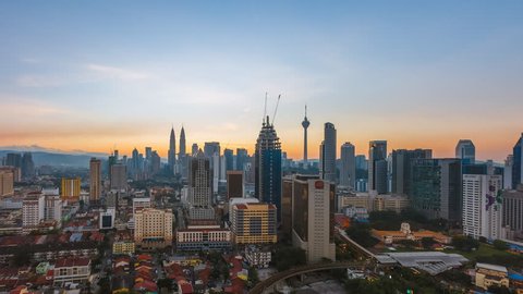 Time lapse: Beautiful city view during dawn overlooking Kuala Lumpur city skyline in Malaysia. Prores 1080p. Pan up motion timelapse.