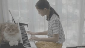 4K Ungraded Asian girl playing piano, vlog video
