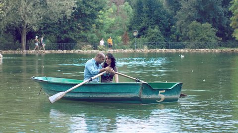 lovers on the rowboat on the lake in Rome