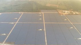 Aerial view of Solar Panels Farm (solar cell). Drone flight fly over solar panels. video 4k.