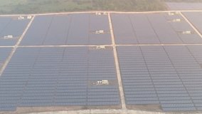 Aerial view of Solar Panels Farm (solar cell). Drone flight fly over solar panels. video 4k.