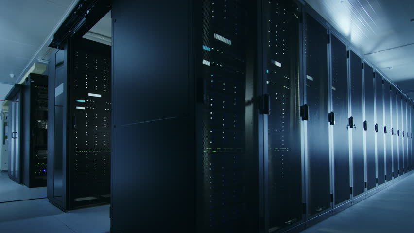 Camera Walkthrough Shot of a Working Data Center With Rows of Rack Servers. Led Lights Blinking and Computers are Working. Room is Dark. Royalty-Free Stock Footage #1021974739