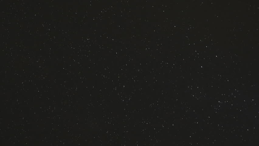 White snow against the black night sky, slow motion | Shutterstock HD Video #1021997077
