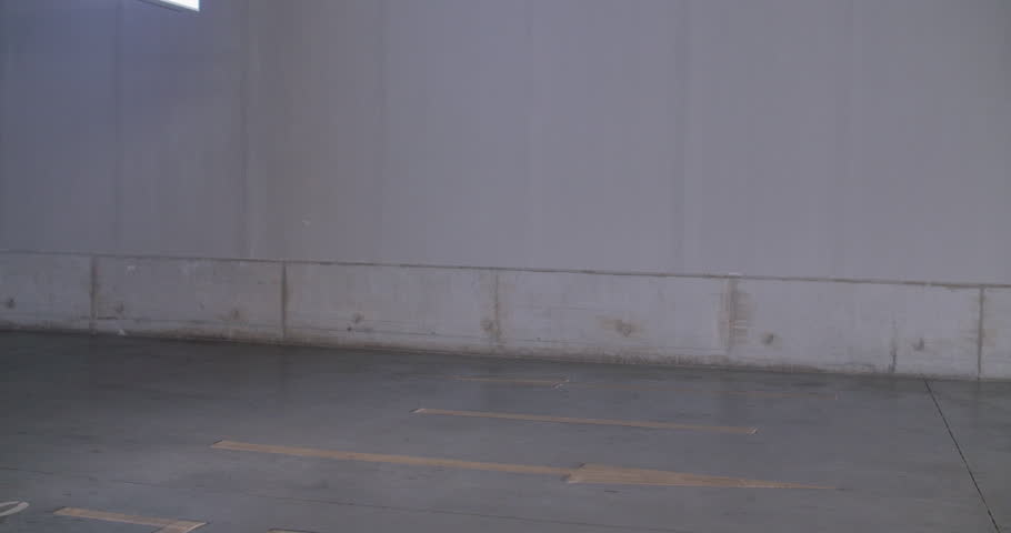 Side view of one young attractive asian woman looking at mobile phone walking in the urban road at summer day, young people using phone lifestyles, 4k