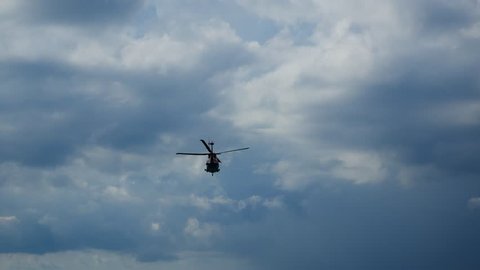Helicopter heading and landing on an offshore oil rig , service travel to oil and gas platform and drilling rig in offshore locations
