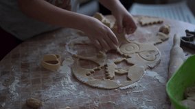 home video - happy kids making cookies at home in the kitchen
