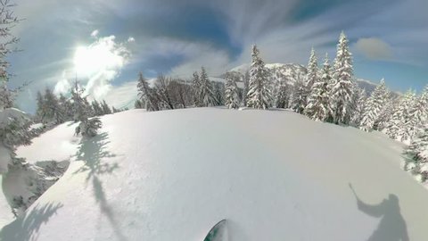 POV VR360: Snowboarding off piste down the untouched powder snow high in beautiful sunny mountains. Spectacular first person view of speeding downhill on a snowboard in the picturesque Slovenian Alps.