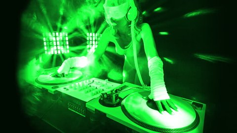 fantastic video of sexy cyber DJ woman filmed in fluorescent clothing under UV black light