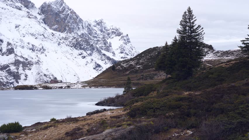 a snow covered landscape in the mountains