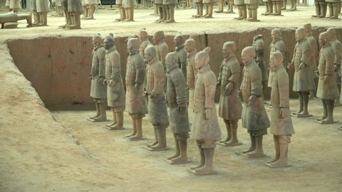 XI'AN, CHINA - 17 OCTOBER 2018: Slow pan across the faces of the pottery terracotta army warriors and soldiers found outside Xi'an China