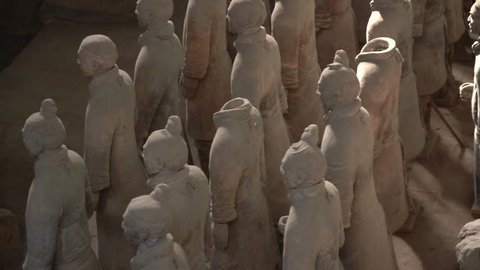 XI'AN, CHINA - 17 OCTOBER 2018: Slow pan across the faces of the pottery terracotta army warriors and soldiers found outside Xi'an China