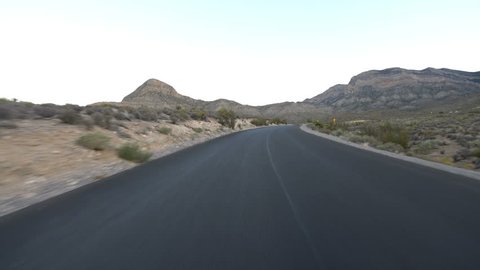 Driving Plate Nevada Desert Winding Road at Sunset 03