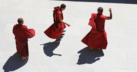 LADAKH, INDIA - 18 SEP 2017: Buddhist monks perform spiritual dance in grounds of Likir monastery, Ladakh, India