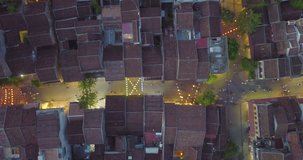 Aerial view of Hoi An old town or Hoian ancient town in night. Royalty high-quality free stock video footage top view of Hoai river and boat traffic HoiAn. Hoi An street and river in night with light