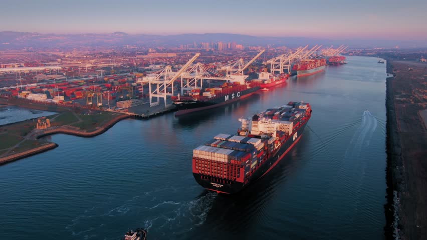 Aerial Of Container Ship sailing into the The Port Of Oakland at sunset, California, USA. | Shutterstock HD Video #1022065132